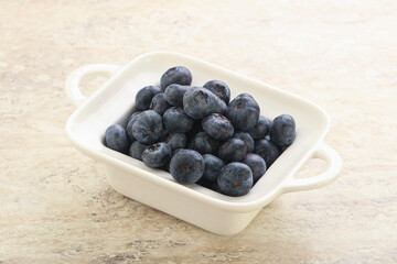 Sweet ripe blueberry heap in the bowl