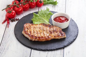 Grilled pork steak with ketchup