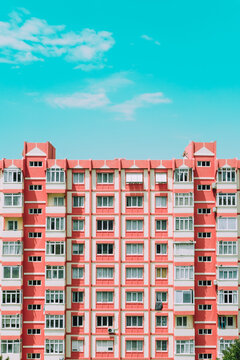 Orange panel building architecture house. Nine-story old urban residential houses with windows
