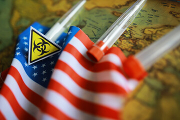 American flag and biohazard sign. The concept of American biolabs and research centers.