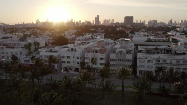 Aerial Panning Shot Of Restaurants By Residential Buildings In City During Sunset - Miami, Florida