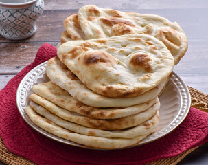 Tandoori Nan, A delicious and healthy wheat based flat bread, baked in clay oven. A famous bread of Pakistan, Afghanistan and Indian.
