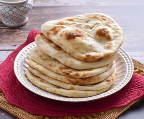 Tandoori Nan, A delicious and healthy wheat based flat bread, baked in clay oven. A famous bread of Pakistan, Afghanistan and Indian.