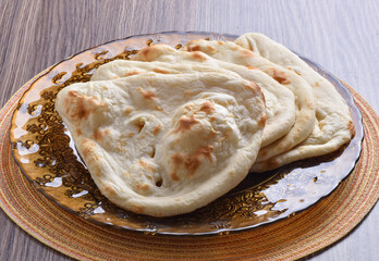 Tandoori Nan, A delicious and healthy wheat based flat bread, baked in clay oven. A famous bread of Pakistan, Afghanistan and Indian.