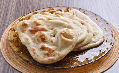 Tandoori Nan, A delicious and healthy wheat based flat bread, baked in clay oven. A famous bread of Pakistan, Afghanistan and Indian.