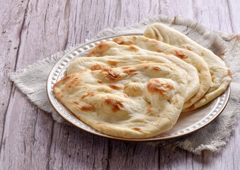 Tandoori Nan, A delicious and healthy wheat based flat bread, baked in clay oven. A famous bread of Pakistan, Afghanistan and Indian.