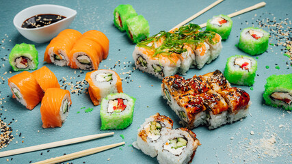 Fresh and tasty sushi rolls on table, sushi bar menu, asian food table.