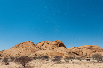 Night shot of the Namibian Desert near Spitzkoppe, under a clear starry southern sky.