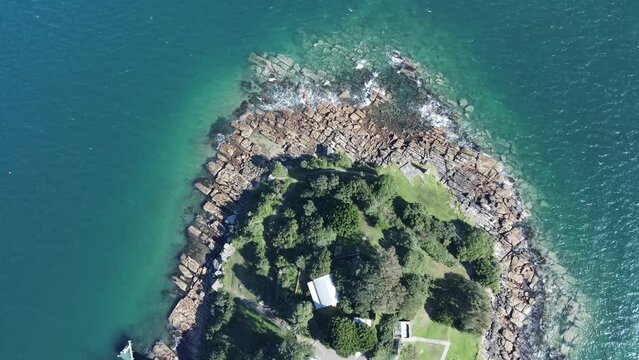 Aerial drone view descending downward above South Head at Watsons Bay in East Sydney, NSW Australia on a sunny day 