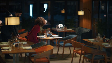 Multiracial couple going out on romantic dinner date in night restaurant cafe.