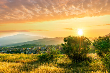 Obraz premium picturesque highland landscape with amazing view from hill with golden grass and green bushes