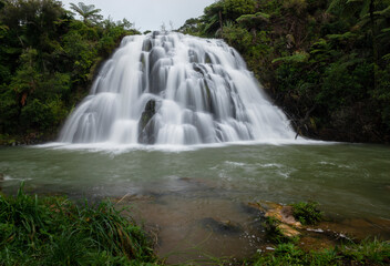 The stunning staircase Owharoa Falls are nested in the heart of the Karangahake Gorge, New Zealand.
