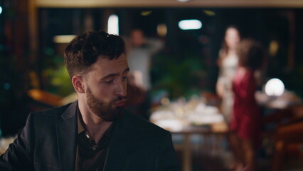 Fototapeta premium Happy guy dancing party in restaurant. Handsome man enjoying celebration in bar.