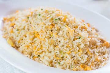 Fried rice with crab with vegetable and eggs in a white plate