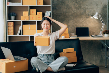 Asian woman working in modern warehouse and delivery service via modern technology