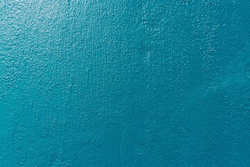 Fototapeta na wymiar Mur bleu texturé pouvant servir de fond