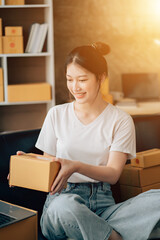 Asian woman working in modern warehouse and delivery service via modern technology