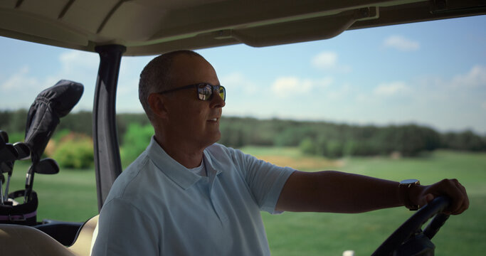 Luxury Golf Sportsman Walking To Golfing Car. Rich Guy Sit Cart At Country Club.