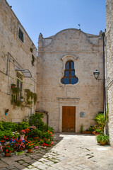 A small church in Casamassima, a village with blue-colored houses in the Puglia region of Italy.