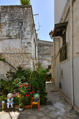 A small street in Casamassima, a village with blue-colored houses in the Puglia region of Italy.