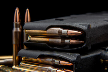 Bullet isolated on black background with reflexion. Rifle bullets close-up on black back. Cartridges for rifle and carbine on a black.