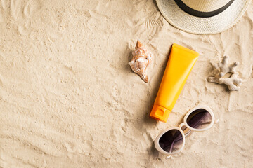 Sunscreen sunblock lotion on sandy beach