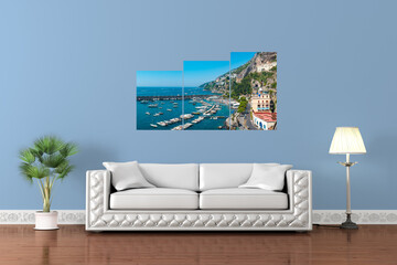 3-part wall canvas to decorate a living room wall with sofa. The canvas is a panorama of the Amalfi harbour. Italy