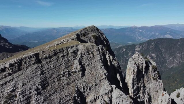 Aerial drone video from iconic and beautiful lake Drakolimni of Tymfi mountain which resides at high altitude above sea, Vikos National Park, Zagori, Greece