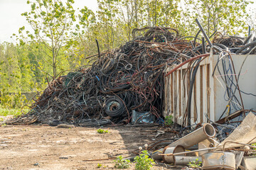 Processing industry, a pile of old scrap metal, ready for recycling. Scrap metal recycling.
