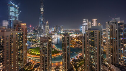 Fototapeta premium Dubai Downtown cityscape with tallest skyscrapers around aerial night timelapse.