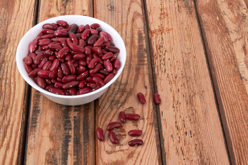Obraz na płótnie Canvas Red beans on wooden