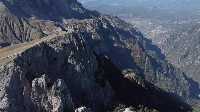 Aerial drone video from iconic and beautiful lake Drakolimni of Tymfi mountain which resides at high altitude above sea, Vikos National Park, Zagori, Greece