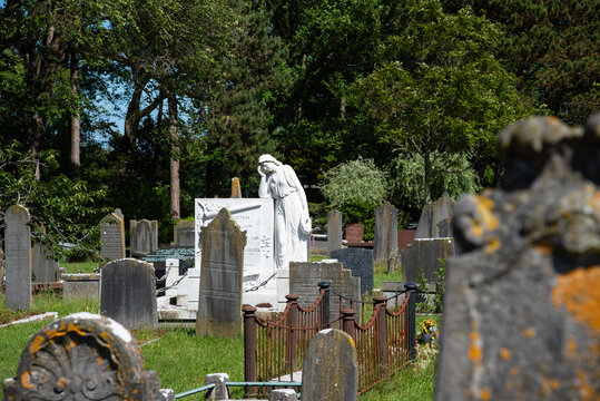 Den Helder, Netherlands, June 2022. Old dilapidated graves in the cemetery of Den Helder.