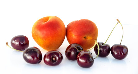 Apricot and cherry  isolated on white background
