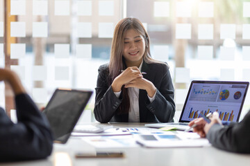 Business meeting. Businesswomen at the meeting discuss market growth strategy analysis and business investment planning.