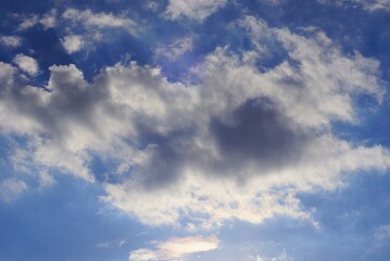 Naklejka na ściany i meble one big gray white cloud on a blue sky on a sunny day