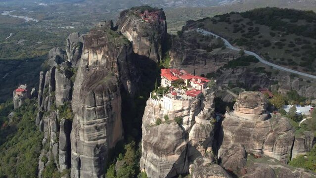 Aerial view of monastery Trinity and breathtaking pictures of valley and landmark canyon of Meteora, Polichni, Kalambaka, Greece. Mountains as columns