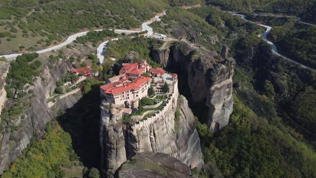 Aerial view of monastery Trinity and breathtaking pictures of valley and landmark canyon of Meteora, Polichni, Kalambaka, Greece. Mountains as columns