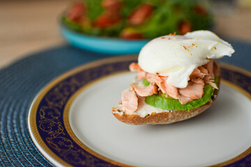 Poached Egg Benedict Toast with Avocado and Salmon.
