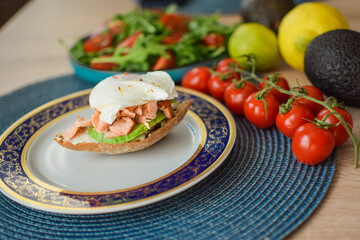 Poached Egg Benedict Toast with Avocado and Salmon.
