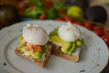 Poached Egg Benedict Toast with Avocado and Salmon.