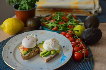 Poached Egg Benedict Toast with Avocado, Salmon and Rucola.