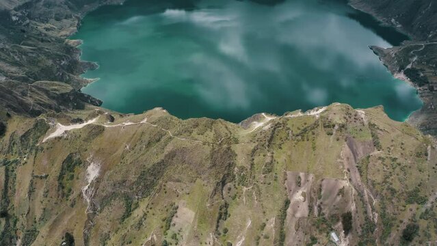 Fly Over Quilotoa Crater Lake In Ecuadorian Andes Volcano In South America. Aerial Tilt-up