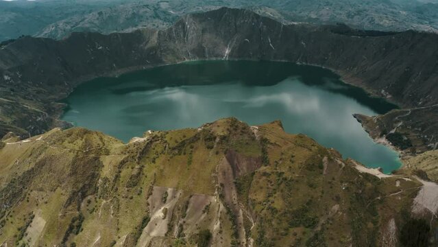 Ecuadorian Andes Volcano And Blue Lagoon Of Quilotoa In Ecuador. Aerial Tilt-up Shot