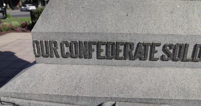 Our Confederate Soldiers on base of statue in Franklin, Tennessee with pan video in slow motion.