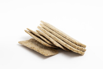 Dried wheat dietary light brown bread on a white background isolated