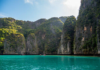 Vacation holidays summer background. A beautiful view of island with boats and tourists in the island. Thailand 