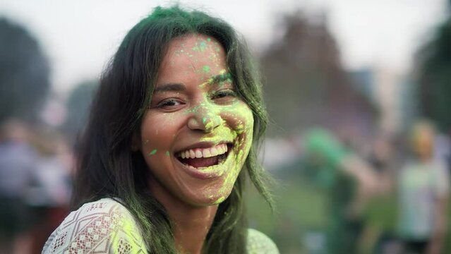 Close up of multiracial woman looking at camera at holi festival. Shot with RED helium camera in 8K. 