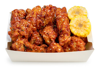 Korean Fried chicken in paper bucket isolated on white background, Korean spicy sauce fried chicken on white With clipping path.