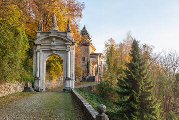 Sacred way at sunset. Sacro Monte di Varese or Santa Maria del Monte, Italy, UNESCO site with the third arch and the eleventh chapel